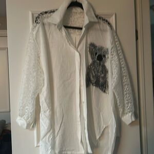 Classic white shirt with a twist…lace sleeves and across back at shoulders.